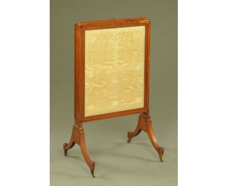 A 19th century mahogany fire screen, with rise and fall action and raised on downswept ebony strung legs.  Width 56 cm. 
