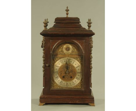 A George III style oak bracket clock, circa 1900 with silvered brass dial marked Simpson Wigton and with later two train stri