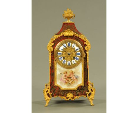 A mid 19th century French Ormolu and boulle marquetry mantle clock, with Sevres style porcelain panel and two train striking 