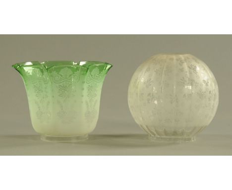 Two Victorian oil lamp shades, green and foliate engraved.  Each width +/- 20 cm. CONDITION REPORT: The clear shade has one s