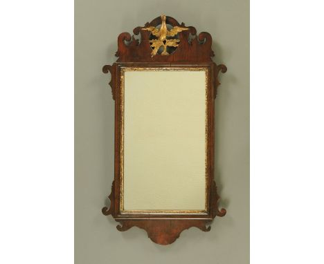 A George III mahogany Chippendale style fretwork wall mirror, with hoho bird pediment.  Height 83 cm, width 45.5 cm. 