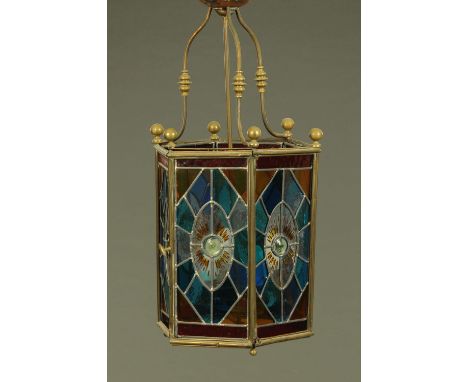 A large Victorian hall lantern, hexagonal, with leaded and stained glass panels.  Overall height 72 cm, width 35 cm (see illu