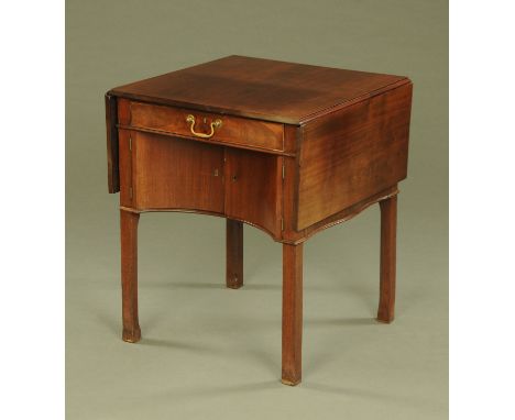 A Georgian mahogany Chippendale style supper table, with drop flap to either side and with frieze drawer and recessed cupboar