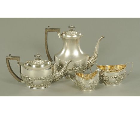 A four piece silver plated tea and coffee service, circa 1900, with ebonised knops and handles, the oval bodies with part emb