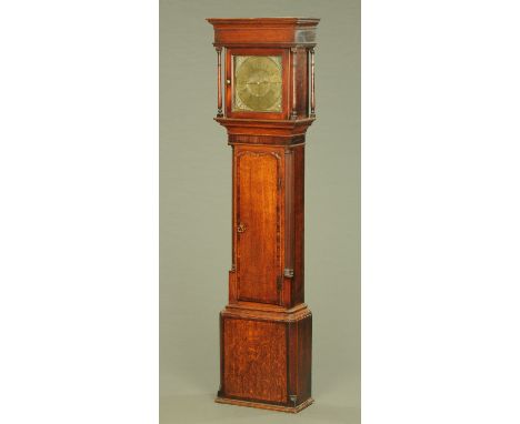 A George III oak longcase clock by Wilkinson of Wigton, thirty hour, with brass dial and date aperture, with long crossbanded