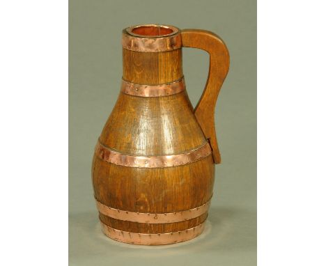 An oak and copper coopered Devon pitcher by J. H. Fry of Barnstaple, early 20th century, the swollen body with five coopered 