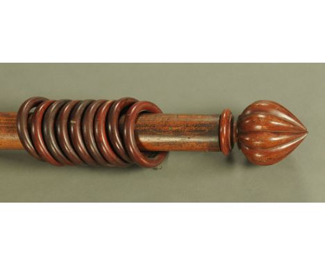 A large Victorian curtain pole, complete with rings.  Length 236 cm.  CONDITION REPORT: The length at 236 cm does include the