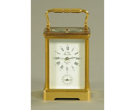 A French brass carriage clock by L'Epee, with repeat mechanism and alarm, with instruction booklet and key.  Height excluding