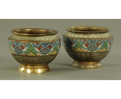 A pair of Chinese champleve enamel and brass jardinieres, 11.5 cm high, interior diameter 12 cm.