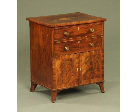 An early 19th century mahogany commode, modelled as a chest of drawers above cupboard and all raised on splayed bracket feet.
