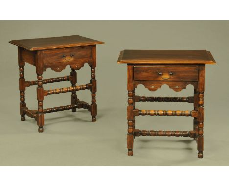 A pair of side tables, each with moulded edge and single drawer and with shaped apron beneath and with bobbin turned stretche