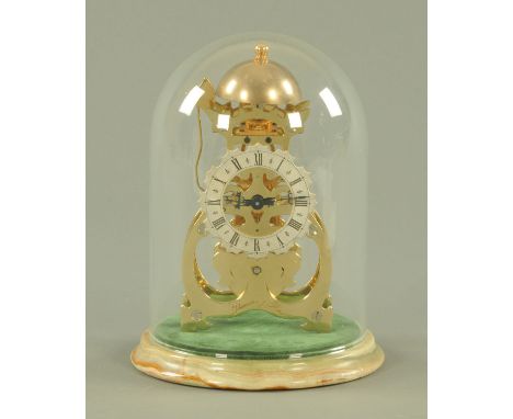 A Thwaites &amp; Reed skeleton clock, Limited Edition 285/1000, brass with silvered dial, raised on an onyx base and with gla
