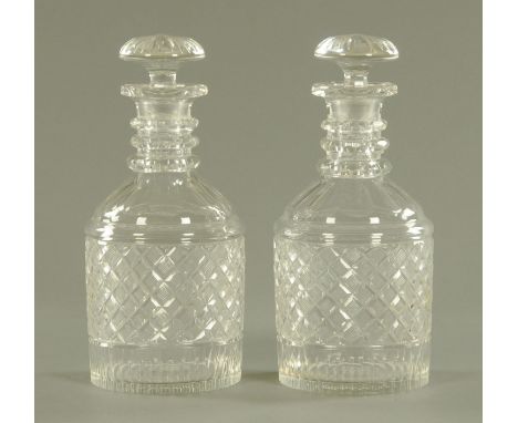 A pair of George III style cut glass decanters, with mushroom stoppers and faceted three ring neck, 26.5 cm high. CONDITION R