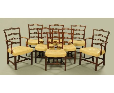 A set of two carver arm and six single George III style mahogany ladder back dining chairs, with leather seats and raised on 
