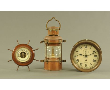 A Smiths Empire brass ships style clock, with single train movement, case diameter 18 cm,  a ships wheel aneroid barometer an