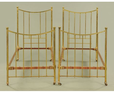 A pair of 19th century brass single beds, each with two ends and side rails.  Width 91 cm. CONDITION REPORT: The bed frames w
