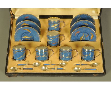 A Wedgwood porcelain coffee service with silver mounts, each piece decorated in gilt with fish, the cups with silver frame mo