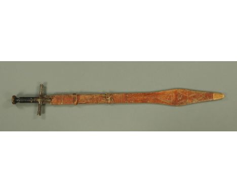 A Sudanese Kaskara, with broad double edged blade stamped "15", with crosspiece and leather bound grip, with disc pommel, all