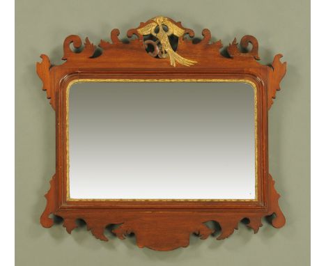 A Chippendale style mahogany fretwork wall mirror, with hoho bird surmount.  Width 73 cm, height 99 cm.