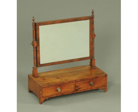 A 19th century mahogany toilet mirror, rectangular, the base fitted with two drawers with brass knob handles and bracket feet