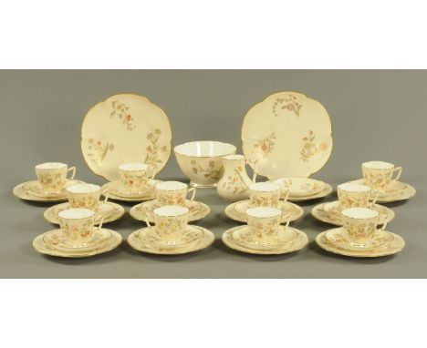 A Royal Worcester porcelain tea service, with ivory ground., 40 pieces. CONDITION REPORT: This service has been wrapped in ne