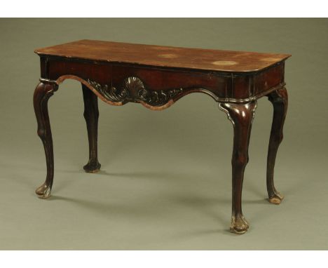 A George III mahogany console table, possibly Irish, with later mahogany top and with shell carving to the frieze raised on f