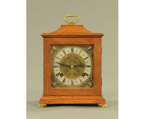 A mahogany cased mantle clock, with two train striking movement, with silvered brass dial and brass bracket feet.  Width 20 c