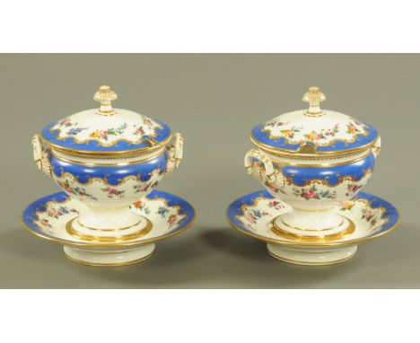 A pair of Paris porcelain tureens with integral stands, marked Nast a Paris and hand painted with floral sprays.  Height 20 c