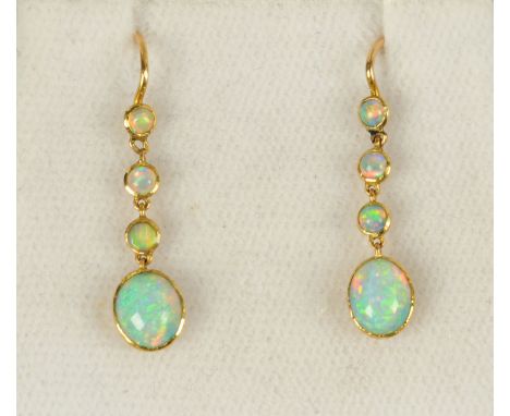 A pair of 15 ct gold opal earrings.