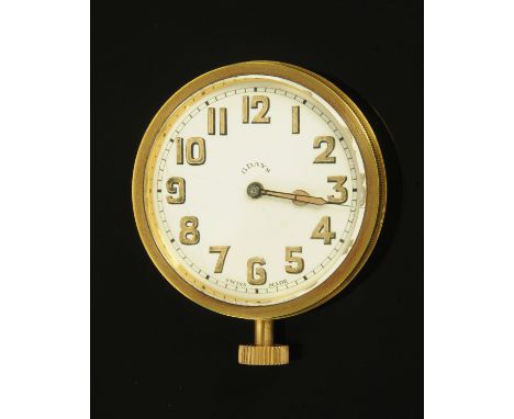 A Swiss made eight day brass car clock, probably from a Model T Ford, knob wind.  Diameter 65 mm. 