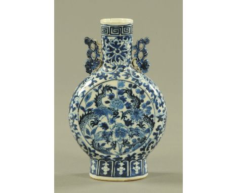 A 19th century Chinese moon flask, decorated with dragons.  Height 21 cm. CONDITION REPORT: The top of the vase has a hairlin