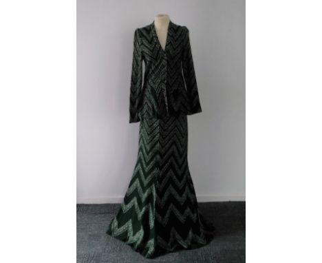 ARISTOS OF CARNABY STREET; A VINTAGE WOOL KNITTED TWO-PIECE comprising green jacket and long skirt, circa 1970