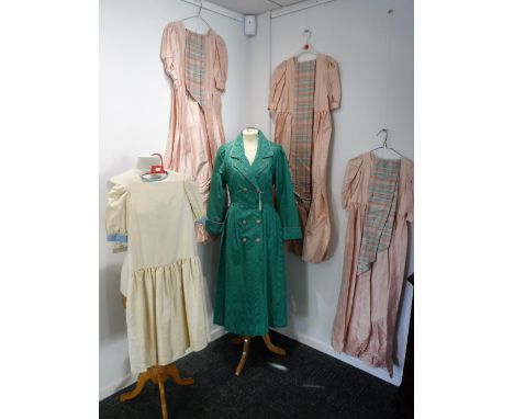 A LONG GREEN VINTAGE SHOT-SILK DOUBLE BREASTED COAT, edged in pink and three raw silk bridesmaids dresses and another similar