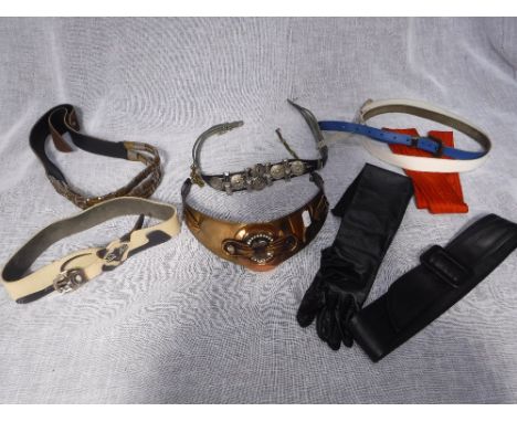 ERMANI BULATTI; A YELLOW METAL VINTAGE BELT and a collection of similar belts