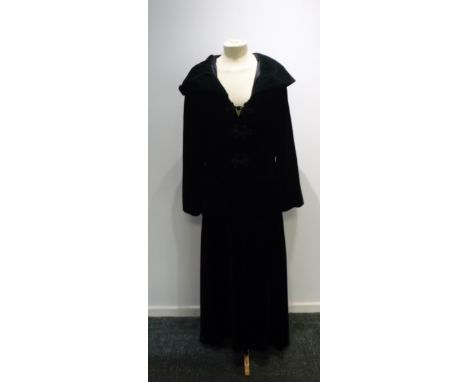 A VINTAGE BLACK VELVET LONG EVENING COAT WITH HOOD, the hood lined in dark green velvet with knotted rope button detail