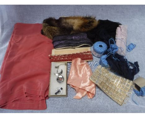 A COLLECTION OF VINTAGE TRIMS, fabrics and similar items