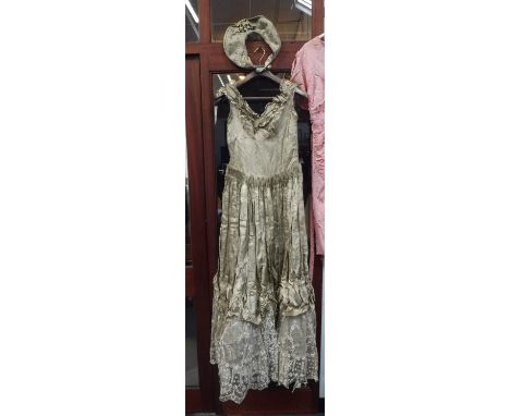 A VINTAGE WEDDING DRESS, circa 1910 in gold and silver brocade fabric