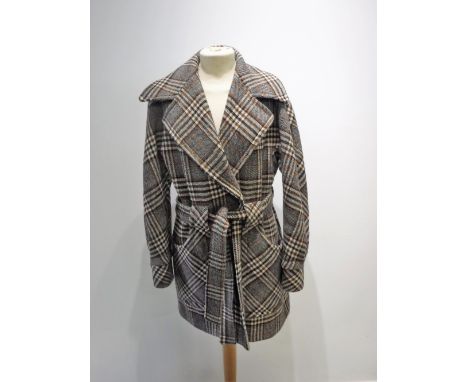 A VINTAGE BROWN CREAM AND BLACK CHECKED CAR COAT, with oversized collar and large pocket detail, size 12, circa 1970