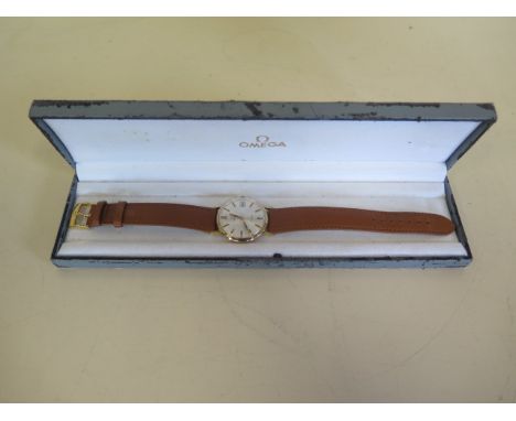 An Omega Geneve 9ct gold manual wind presentation manual wind wristwatch with date - case 33mm wide, good condition, running 