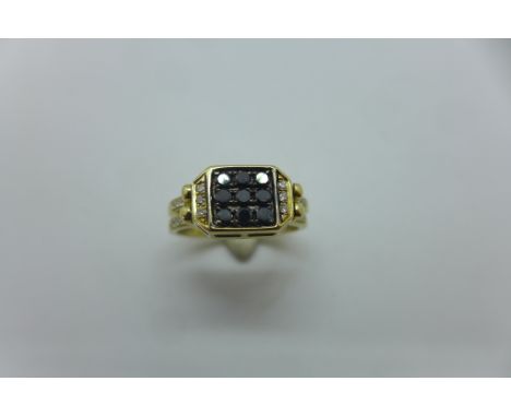 An unusual 14ct reversible diamond ring, the two sided head of ring set with white diamonds one side black diamonds to the ot