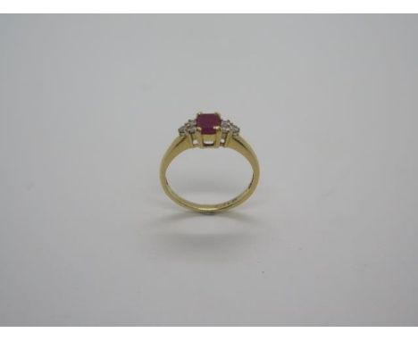 An 18ct hallmarked ruby and diamond set ring, diamonds approx 0.12ct, ring size K/L, approx 2.9 grams, in good condition 