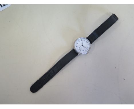 A silver trench watch, manual wind, in good condition, running order, 33mm wide 