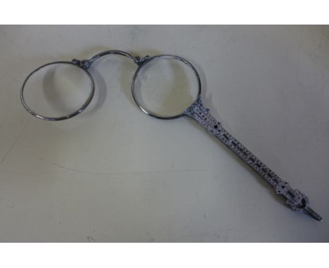 A pair of continental 935 silver lorgnette set with coloured glass or paste, one lens chipped otherwise reasonably good 