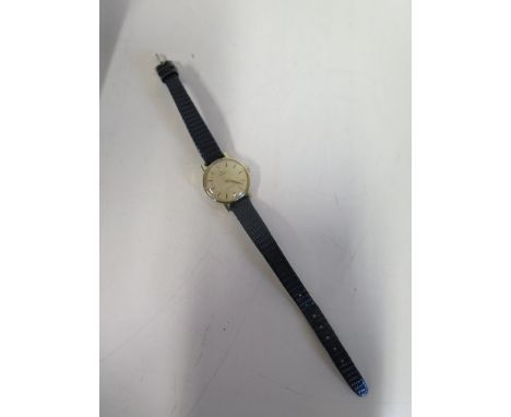 A ladies Omega de Ville, gold plated manual wind wristwatch, 23mm wide, on a leather strap, running order, some usage marks 
