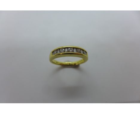 An 18ct hallmarked gold diamond ring, size P, set with five diamonds, approx 5.3 grams, in good condition 