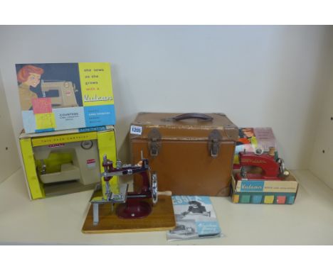 Three vintage childs sewing machines, two Vulcans and an Essex 