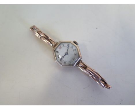 A 9ct yellow gold ladies manual wind wristwatch, on a sprung strap, not working, total weight approx 15 grams 