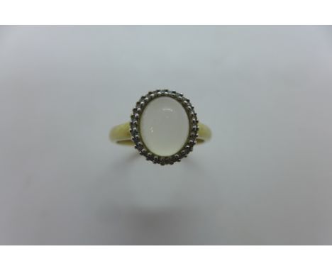 A 9ct hold hallmarked moonstone and diamond ring, size Q, approx 2.9 grams, in good condition 