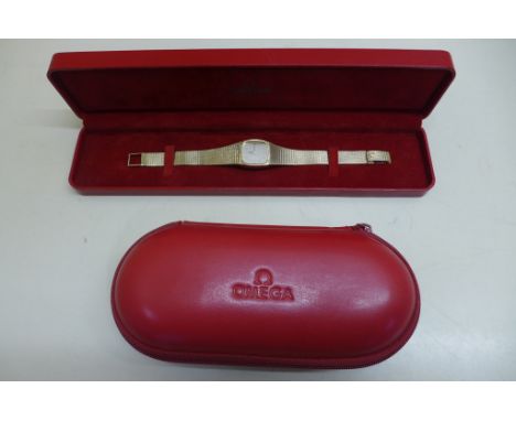 A ladies Omega 9ct gold manual wind bracelet wristwatch with 20mm case, total weight approx 35.6 grams, in good condition, ru