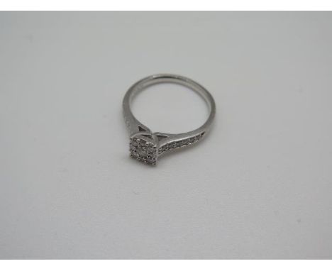 A 950 platinum and diamond cluster ring, approx 0.32ct in total, ring size M, approx 4.2 grams, some usage but generally good